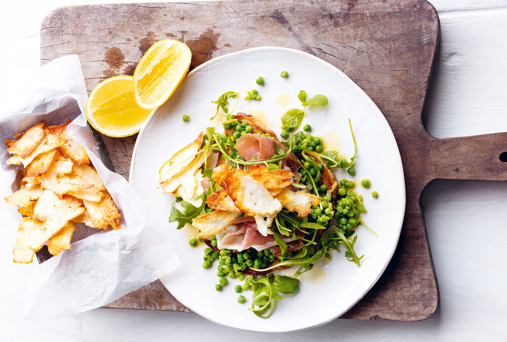 Smashed pea and prosciutto salad with haloumi crisps