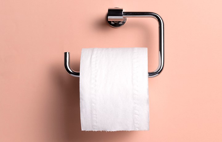 toilet roll with pink background